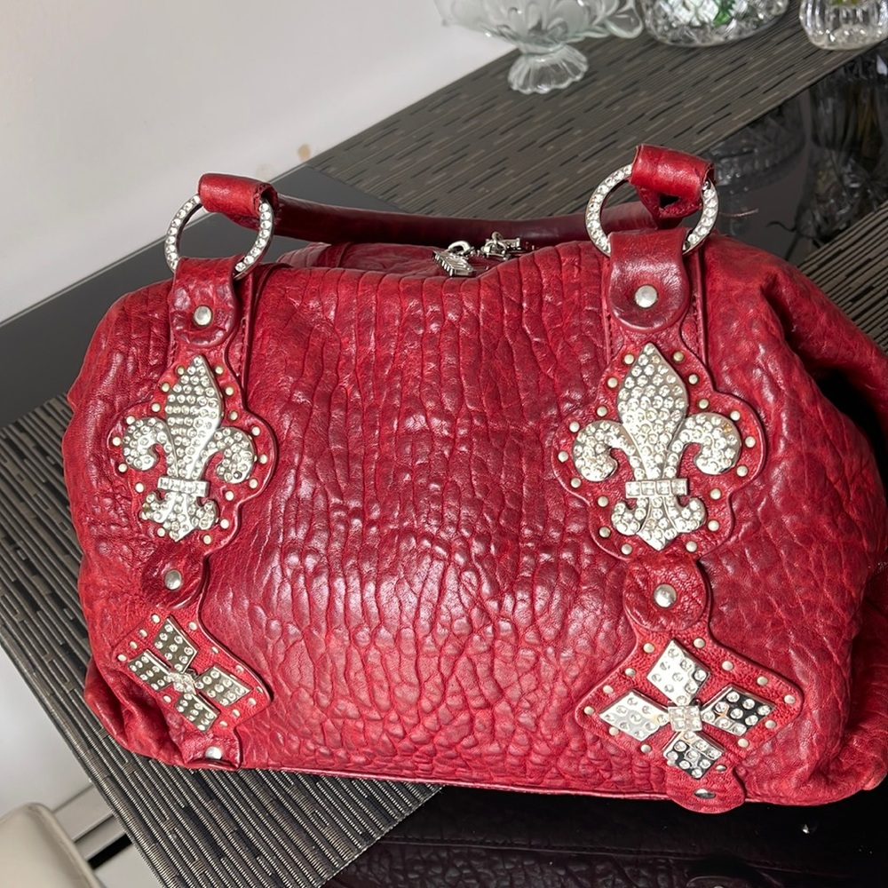 Charm and Luck red leather bag with rhinestone embellishments